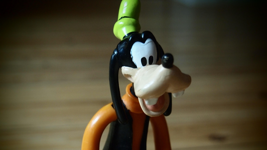 The cartoon character Goofy, used humorously to represent the well-meaning but incompetent officer who gets promoted simply because he aced the test