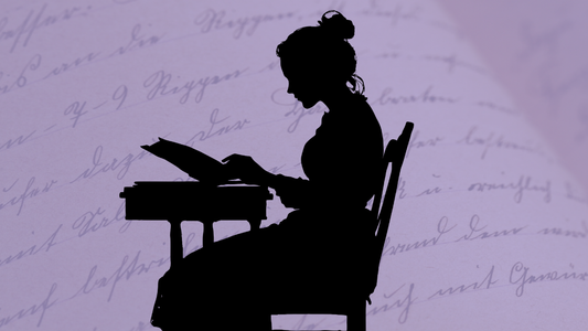 woman seated at computer typing